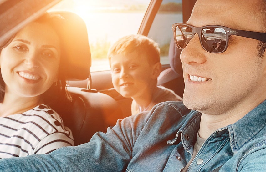 Family sitting in a car